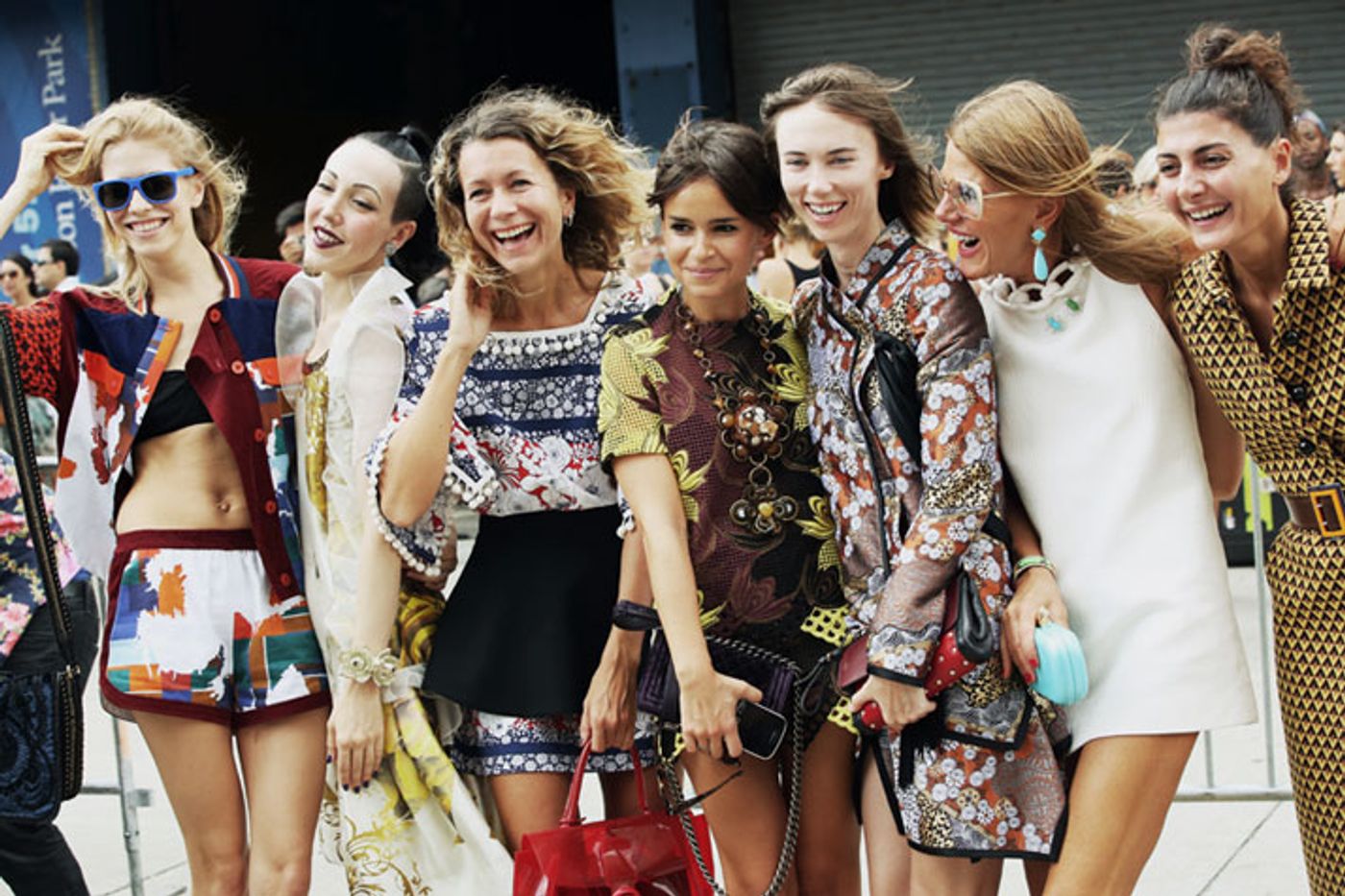 from left to right: Elena Perminova, Michelle Harper, Natalie Joos, Miroslava Duma, Anya Ziourova, Anna Dello Russo, Giovanna Battaglia photo © Streetfsn by Nam.